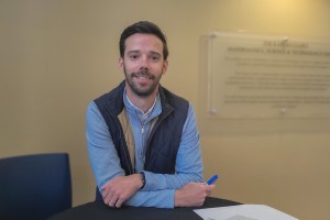 A man, Mark Sovyn, smiles at Mount Saint Mary College.
