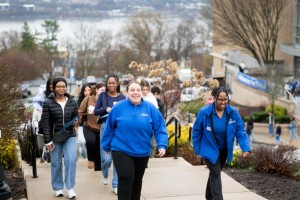 Admissions ambassadors showing prospective students around campus. 