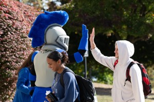 Mack the Knight giving a high-five.