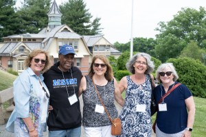 Alumni smile at Mount Saint Mary College. 
