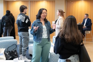 Woman talks to another woman and smiles. Christina Mistretta ’19, a teacher and retreat director, speaks with a current Mount Saint Mary College student