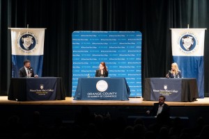 Orange County Chamber of Commerce President and CEO Heather Bell moderates the congressional forum featuring candidates Jackie Auringer (right) and U.S. Rep. Pat Ryan (left) at Mount Saint Mary College.