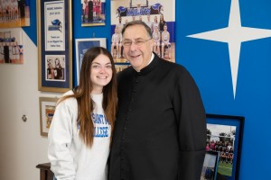 Mount Saint Mary College alumna Summer Lown ’24, an EMT with Town of Newburgh Emergency medical Services, and Fr. Gregoire Fluet, Vice President for Mission and Ministry, visit with each other in Fr. Fluet’s office a few weeks after a medical emergency th