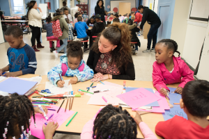 Mount student working with a table of children