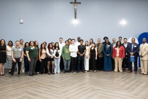 Many people standing and smiling at Mount Saint Mary College