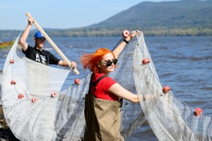 Aleksandra Belugin of New Windsor, N.Y. (center) assists with environmental research on the Hudson River alongside fellow students in Mount Saint Mary College’s Natural Sciences department. 