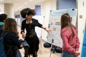 Mount Saint Mary College students discusses their findings with faculty members and fellow students during the iROC research symposium on December 3