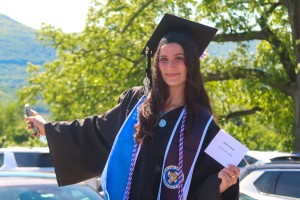 Woman smiling. Mount Saint Mary College accelerated nursing graduate Julianna Zeidan smiles proudly at the college’s Commencement ceremony. Zeidan was the final graduate in the procession for both the Nurse Pinning ceremony and the main Commencement exerc