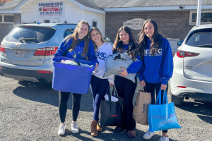 Mount Saint Mary College KDP members deliver about 1,000 donations to the Highland New York American Legion, to be sent to victims of Hurricane Helene. From left to right: Catherine McLoughlin of Newburgh, N.Y. (co-membership chair); Maggie Veach of Hopew