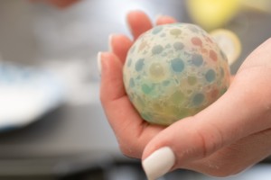 A Mount Saint Mary College student displays a finished DIY stress ball. 