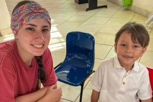 Woman and boy smiling. Nicole Kreischer of Washingtonville, N.Y., who will graduate from Mount Saint Mary College this May, participated in two international service trips to Honduras. It was an experience that helped shape her career goals in student eng