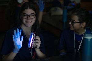 Student holding blacklight at Mount Saint Mary College