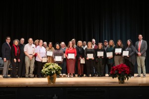 Mount Saint Mary College faculty and staff gather on stage to be recognized for their long-term dedication to the college. Honorees celebrated milestones ranging from five to 50 years of service. 
