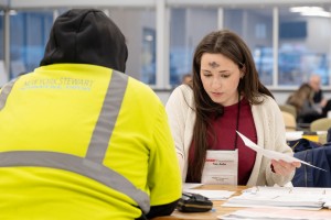 Mount Saint Mary College accounting student Rhiannon T. Petrakis assists a local resident during a Tax-Aide session on February 18, Ash Wednesday