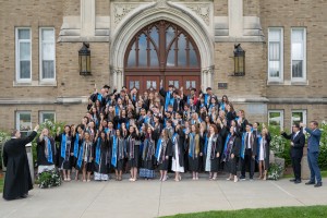 Many people stand and smile during a toast. Mount Saint Mary College’s Class of 2026 celebrates with a toast on Friday, May 15.
