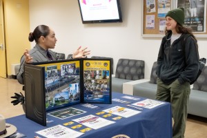 Mount Saint Mary College junior Faith Welsh of Goshen, N.Y., a social science major, talks with N.Y. State Police Trooper Briana Gigante during a recruitment event on Tuesday, March 17. 