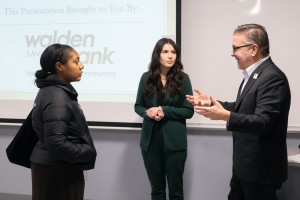 Derrik Wynkoop (right), president and CEO of Walden Savings Bank, and Nicole Matthews (center), Walden Savings Bank Montgomery branch manager, discuss business financing with a Mount Saint Mary College student during a Business Law class in Aquinas Hall. 