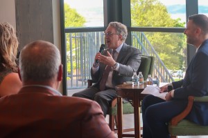 Man with microphone. John C. Williams, President and Chief Executive Officer of the Federal Reserve Bank of New York, discussed the U.S. economy during his visit to Mount Saint Mary College on Thursday, May 7.