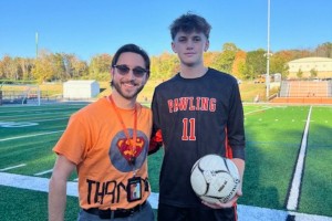 Mount Saint Mary College graduate Education student Zachary Grzeczka (left) stands with the Pawling High School student-athlete who nominated him for the “Shirt Off Our Backs” award. 