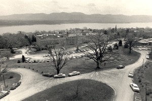 A black and white photo of the Mount campus, overlooking Aquinas Hall with the Hudson River and Mountains in the background.