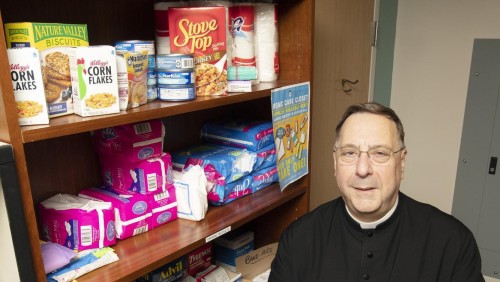 Fr. Greg standing in front of the care closet.