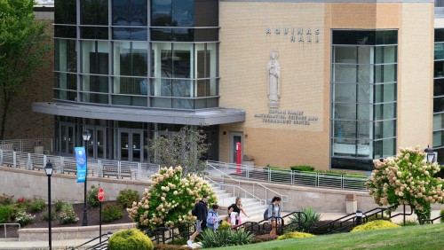 Students in front of Aquinas Hall