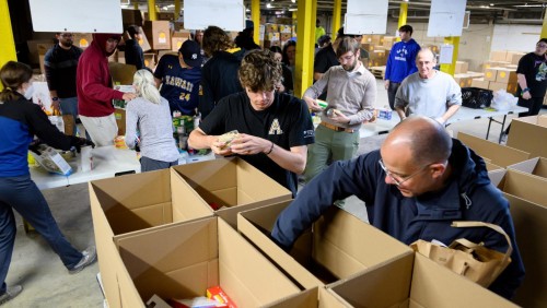 Students and families volunteering at the food bank.