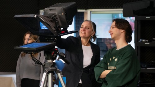 Image of a student in the state-of-the-art studio with professor.