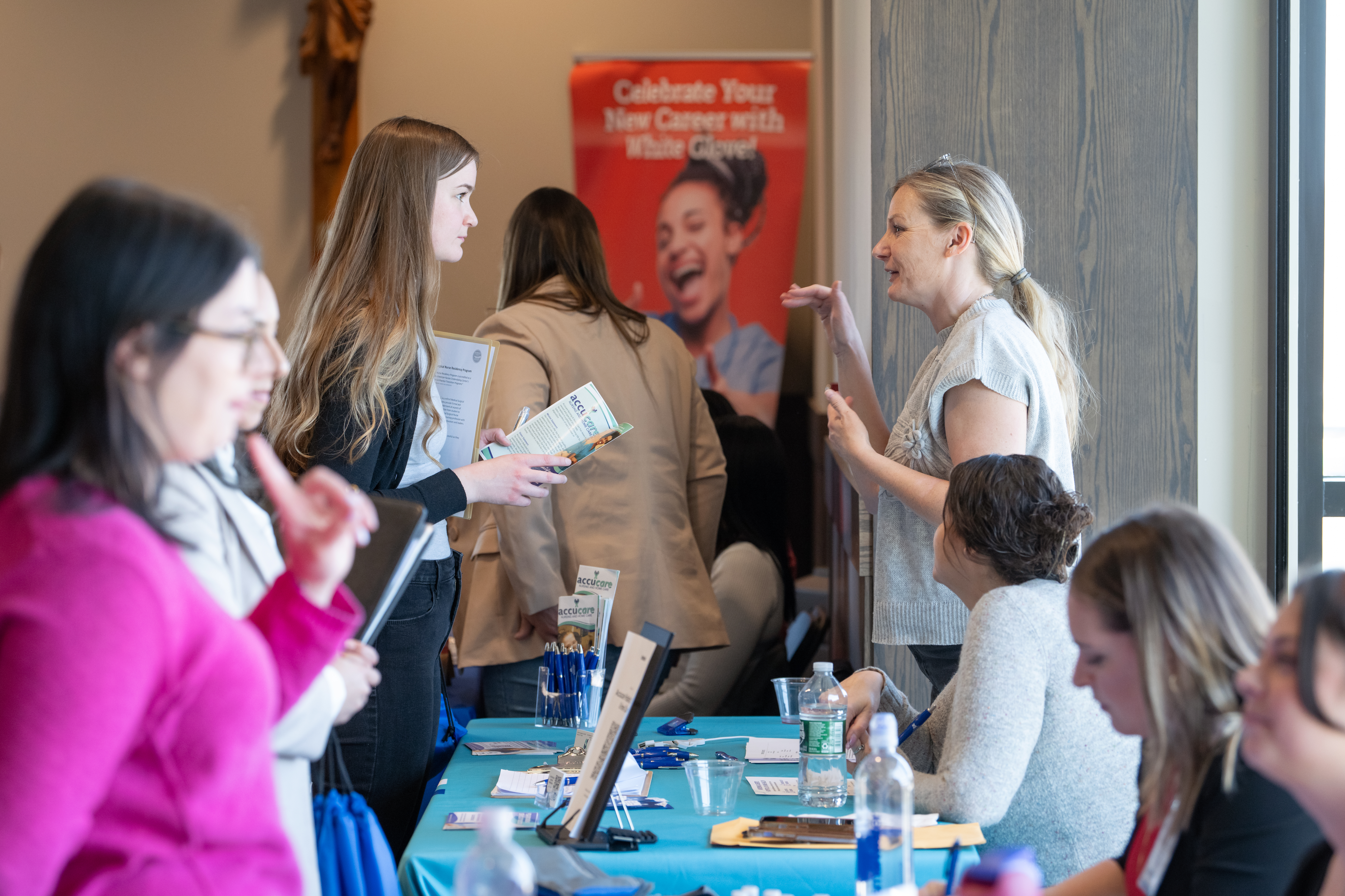 A student talking to a representative at a recent Job Fair held on campus.